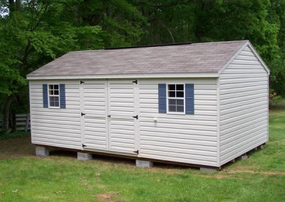 12 x 20 V-A-roof with silvermist siding and trim, driftwood shingles, slate blue shutters and a ridgevent