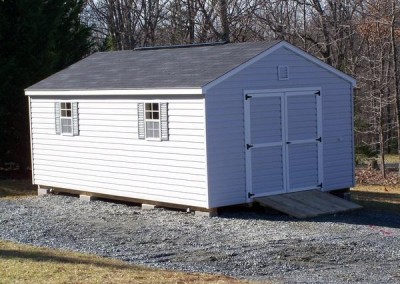 12 X 20 V-A-roof with gray siding, white trim, pacific blue shutters and onyx black shingles