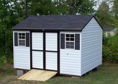 10 x 12 A-roof with white siding, black trim, black shingles and black shutters