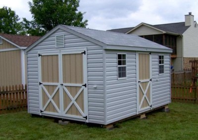 10 x 14 V-A-roof with gray siding, white trim around doors, and aspen gray shingles