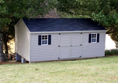 12 x 20 V-A-roof with clay siding and trim, onyx black shingles, and black shutters