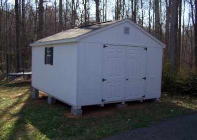 12 x 16 Painted A-roof painted white with white trim, black shingles and shutters, fiber doors and ridge and gable vents