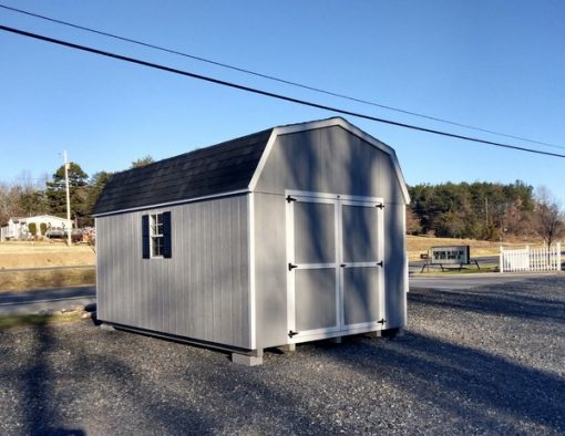 10 x 16 size painted high barn style shed with gap gray siding, white trim, black architectural shingle roof, black shutters, 8' ridge vent, ggs 6 foot doors, two windows.