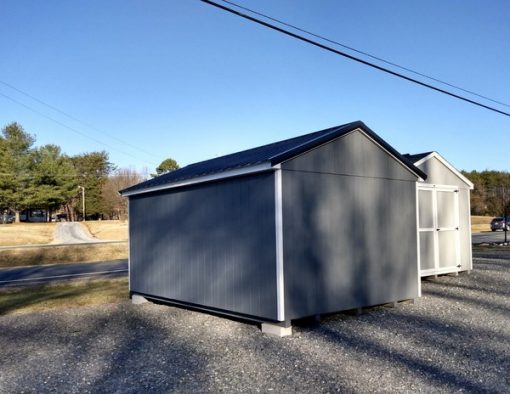 10 x 16 size painted a-roof style shed with gray siding, white trim, black metal roof, black shutters, fiber solid 6 foot shed doors and two windows.
