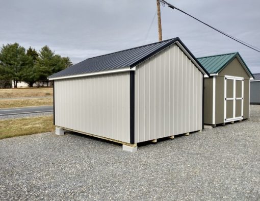 12x16 size metal classic style shed with white trim, gray metal siding, black metal roof, corners and j channel, 6 foot fiber doors with two windows.