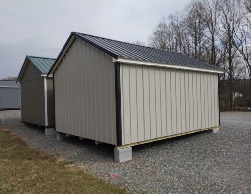 12x16 size metal classic style shed with white trim, gray metal siding, black metal roof, corners and j channel, 6 foot fiber doors with two windows.