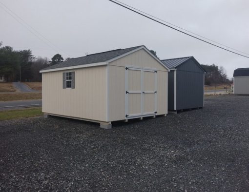 12 x 16 size painted a-roof style shed with navajo white siding, white trim, estate gray architectural shingle roof, gray shutters, 8' ridge vent, ggs 6 foot doors, two windows.