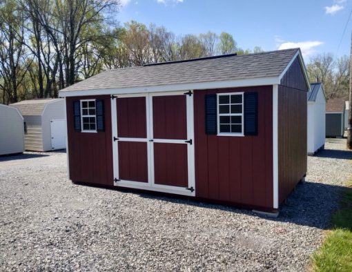 10 x 16 size painted a-roof style shed with pinnacle red siding, white trim, black architectural shingle roof, black shutters, 8' ridge vent, good's garden sheds 6 foot doors, two windows.