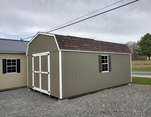 12 x 20 size painted high barn style shed with clay siding, white trim, brownwood architectural shingle roof, brown shutters, 8' ridge vent, ggs 6 foot doors, two windows.