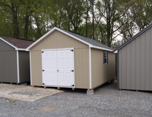 12 x 16 size painted classic style shed with tan siding, white trim, estate gray architectural shingle roof, gray shutters, 8' ridge vent, fiber 6 foot doors, two windows.