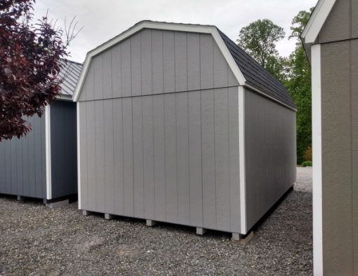 10 x 16 size painted high barn style shed with gap gray siding, white trim, black architectural shingle roof, black shutters, 8' ridge vent, fiber 6 foot doors, two windows.
