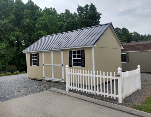 12 x 20 size painted garden style shed with leola almond siding, white trim, black metal roof, black shutters, ggs 6 foot doors and two windows.