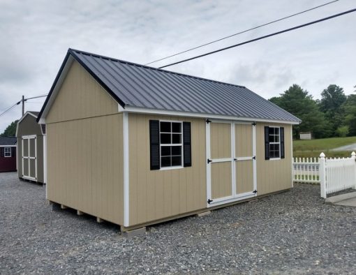 12 x 20 size painted garden style shed with leola almond siding, white trim, black metal roof, black shutters, ggs 6 foot doors and two windows.