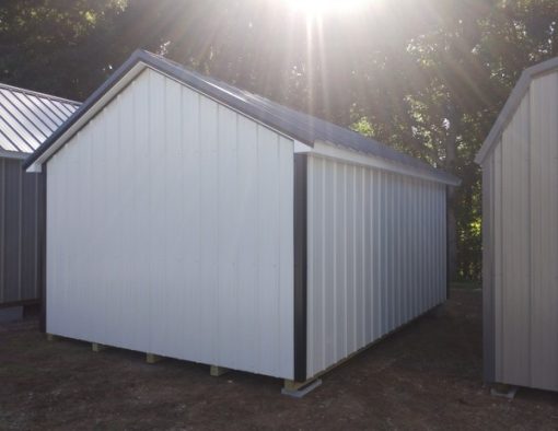 12x16 size metal classic style shed with white trim, alamo metal siding, black metal roof, corners and j channel, 6 foot fiber doors with two windows.