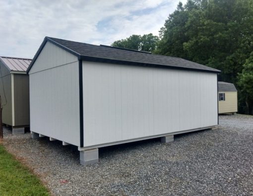 12 x 20 size painted a-roof style shed with barn white siding, black trim, black architectural shingle roof, black shutters, 8' ridgevent, fiber solid 6 foot shed doors, two windows.