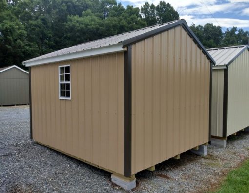 10x12 size metal a-roof style shed with white trim, tan metal siding, burnished slate metal roof, corners and j channel, 6 foot fiber doors and two windows.