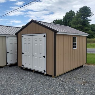 10x12 size metal a-roof style shed with white trim, tan metal siding, burnished slate metal roof, corners and j channel, 6 foot fiber doors and two windows.