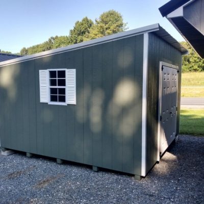 12x12 size painted economy style shed with avocado siding, white trim, alamo metal roof, white shutters, 6 foot fiber doors with two windows.