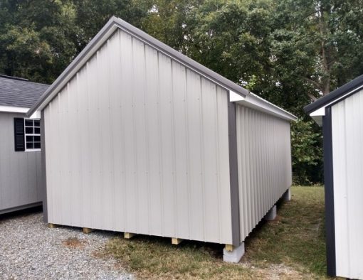 12x20 size metal garden style shed with white trim, gray metal siding, charcoal metal roof, corners and j channel, 6 foot fiber doors with two windows.