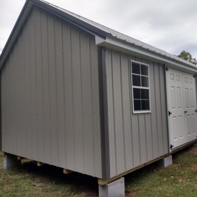 12x20 size metal garden style shed with white trim, gray metal siding, charcoal metal roof, corners and j channel, 6 foot fiber doors with two windows.