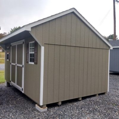 10 x 16 size painted carriage style shed with clay siding, white trim, brownwood architectural shingle roof, brown shutters, 8' ridge vent, ggs 6 foot doors, two windows.