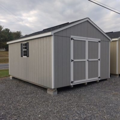 12 x 16 size painted a-roof style shed with gap gray siding, white trim, black architectural shingle roof, black shutters, 8' ridgevent, ggs 6 foot doors, two windows.