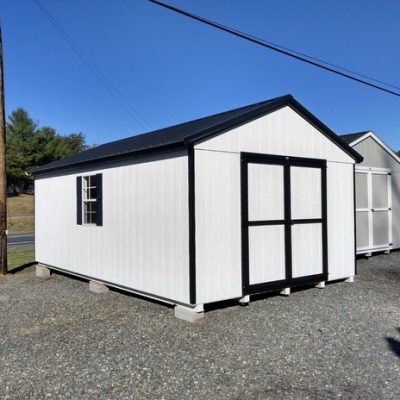 12 x 20 size painted a-roof style shed with white siding, black trim, black metal roof, black shutters, ggs 6 foot double doors, two windows.