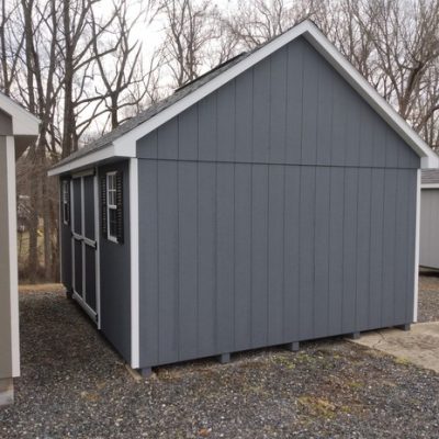 12 x 16 size painted garden style shed with gray siding, white trim, black architectural shingle roof, black shutters, 8' ridge vent, ggs 6 foot doors, two windows.