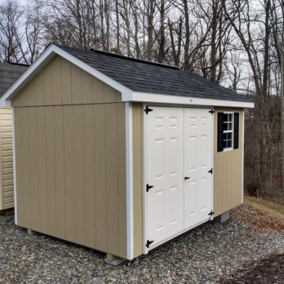 8 x 12 size painted classic style shed with leola almond siding, white trim, black architectural shingle roof, black shutters, 8' ridgevent, fiber solid 6 foot shed doors, one window.