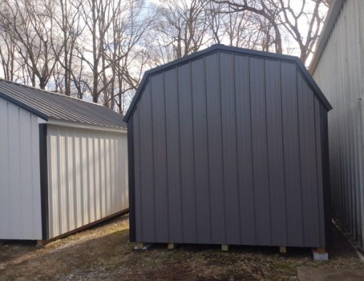 10x16 size metal high barn style shed with white trim, charcoal metal siding, black metal roof, corners and j channel, 6 foot fiber solid shed doors with two windows.