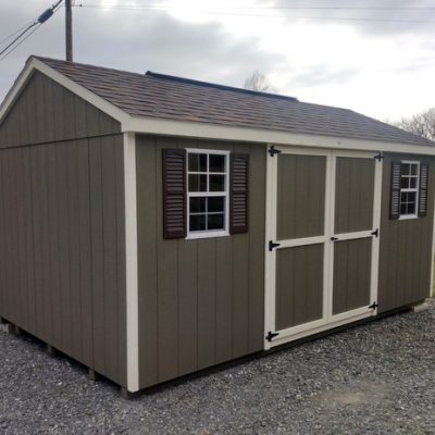10 x 16 size painted a-roof style shed with clay siding, pearl trim, brownwood architectural shingle roof, brown shutters, 8' ridge vent, ggs 6 foot doors, two windows.