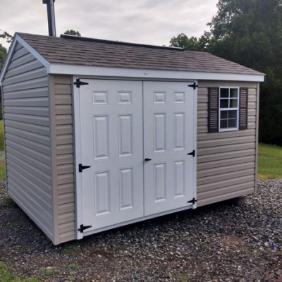 8x12 size vinyl a-roof style shed with clay siding, white trim, brownwood architectural shingle roof, brown shutters. Has 8' ridgevent, 6 foot fiber doors and one window.
