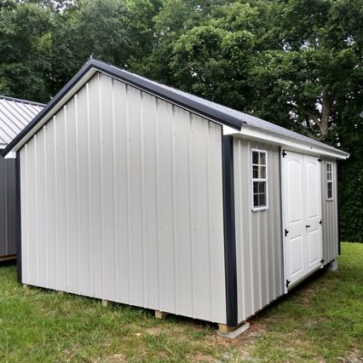 12x16 size metal classic style shed with white trim, gray metal siding, black metal roof, corners and j channel, 6 foot fiber 2 plank doors with two windows.