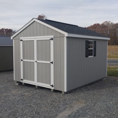 10 x 12 size painted a-roof style shed with gap gray siding, white trim, black architectural shingle roof, black shutters, 8' ridge vent, ggs 6 foot doors, two windows