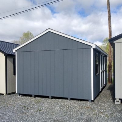 12 x 20 size painted a-roof style shed with gray siding, white trim, black architectural shingle roof, black shutters, (2) 8' ridge vents, ggs 6 foot doors, two windows.