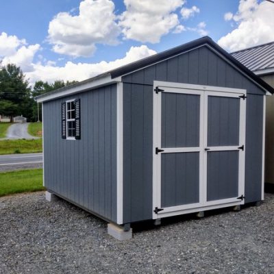 10 x 12 size painted a-roof style shed with gray siding, white trim, black metal roof, black shutters, ggs 6 foot doors, two windows.