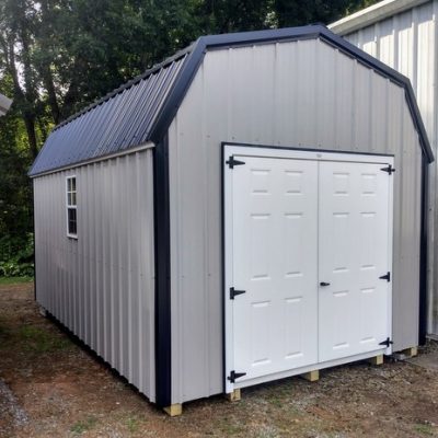 10x16 size metal high barn style shed with white trim, gray metal siding, black metal roof, corners and j channel, 6 foot fiber double shed doors with two windows.