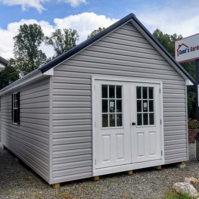 12 x 20 size vinyl garden style shed with flint siding, white trim, black metal roof, black shutters, pre hung 9 lite l.h. outswing 6' double doors 72" tall, two windows.