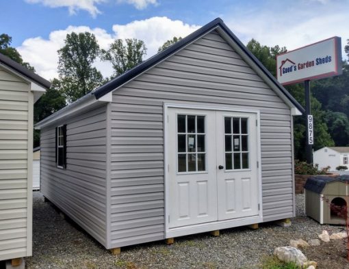 12 x 20 size vinyl garden style shed with flint siding, white trim, black metal roof, black shutters, pre hung 9 lite l.h. outswing 6' double doors 72" tall, two windows.