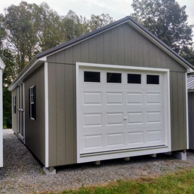 14 x 28 size painted classic garage style shed with clay siding, white trim, burnished slate metal roof, black shutters, garage door with glass, ggs 6 foot double doors 1' ft taller, two windows.