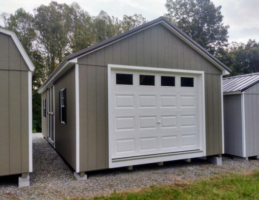 14 x 28 size painted classic garage style shed with clay siding, white trim, burnished slate metal roof, black shutters, garage door with glass, ggs 6 foot double doors 1' ft taller, two windows.