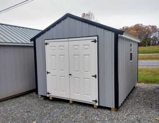 10x12 size metal a-roof style shed with white trim, old town gray metal siding, black metal roof, corners and j channel, 6 foot fiber double shed doors with two windows.