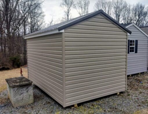 8 x 12 size vinyl a-roof style shed with clay siding, white trim, burnished slate metal roof, burgundy shutters. 6 foot fiber double doors and one window.