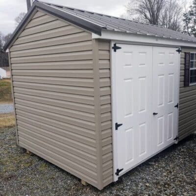 8 x 12 size vinyl a-roof style shed with clay siding, white trim, burnished slate metal roof, burgundy shutters. 6 foot fiber double doors and one window.