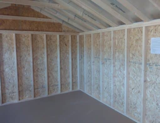 12 x 20 size painted a-roof style shed with gap gray siding, white trim, black metal roof, black shutters, ggs 6 foot doors, two windows.