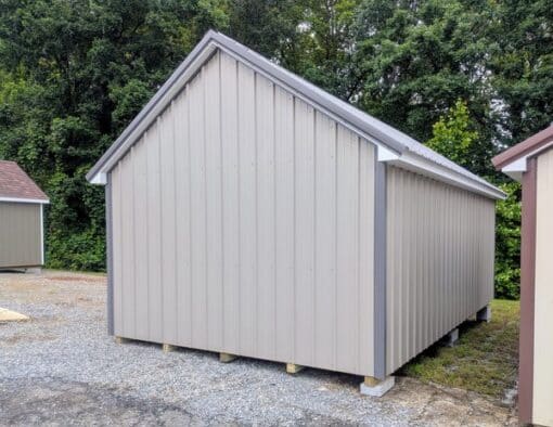 12x20 size metal garden style shed with white trim, taupe metal siding, charcoal metal roof, corners and j channel, 6 foot fiber double shed doors with two windows.