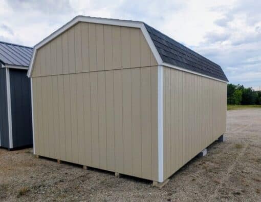 12 x 20 size painted high barn style shed with leola almond siding, white trim, black architectural shingle roof, black shutters, (2) 8' ridge vents, ggs 6 foot double doors, two windows.
