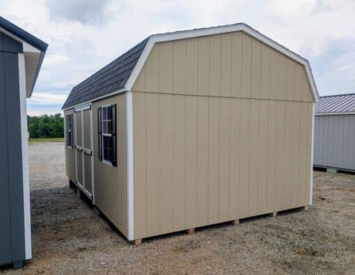 12 x 20 size painted high barn style shed with leola almond siding, white trim, black architectural shingle roof, black shutters, (2) 8' ridge vents, ggs 6 foot double doors, two windows.