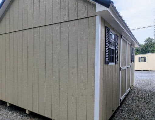 12 x 16 size painted garden style shed with leola almond siding, white trim, black metal roof, black shutters, ggs 6 foot double doors, two windows.