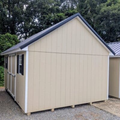 12 x 16 size painted garden style shed with leola almond siding, white trim, black metal roof, black shutters, ggs 6 foot double doors, two windows.